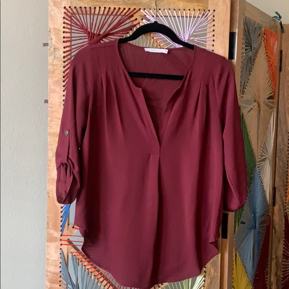 Lush burgundy blouse. Cropped sleeve w/ V cut neck